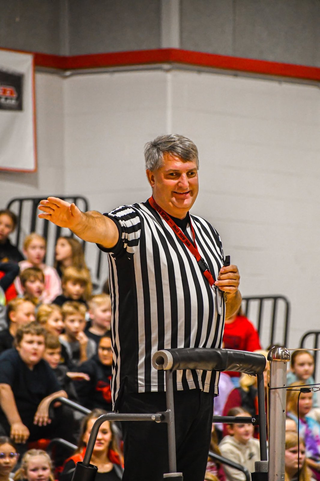 Senator Westrom refereeing a Dads vs. Daughters volleyball scrimmage